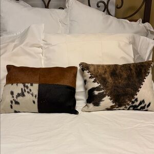 Two cowhide pillows